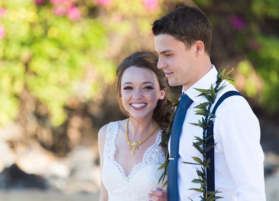 A Maui couple embracing after their beach wedding ceremony