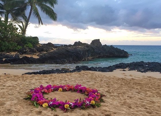 A Maui beach wedding celebration with the couple on the sand