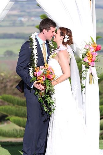 A small Maui beach wedding ceremony with the couple and officiant
